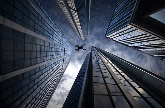 Base jumper across buildings from iStock